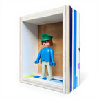 Playmobil huisje 'Blauwgrijs popje met groene pet'